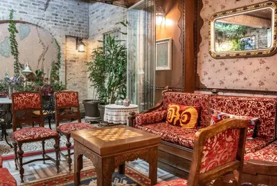 a living room with a couch and chairs at Hotel Niles Istanbul in Istanbul