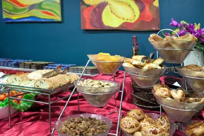 a table with many different types of bread and pastries at Sogut Hotel Old City in Istanbul