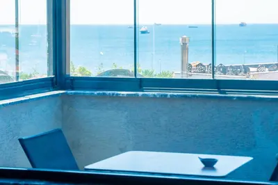 a table in a room with a view of the ocean at Miss Royal Hotel & SPA in Istanbul