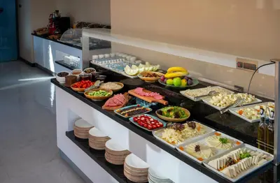 a buffet line with many different types of food at Tan Hotel - Special Category in Istanbul