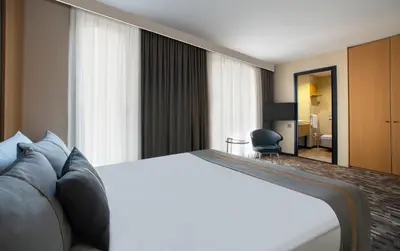 a hotel room with a large bed and a bedroom at Tan Hotel - Special Category in Istanbul