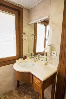 a bathroom with a sink and a mirror at A'la Sofia Hotel İstanbul in Istanbul