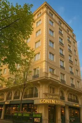a tall tan building with a german hotel at Taksim Gonen Hotel in Istanbul