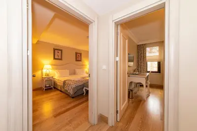 a bedroom with a bed and a desk at Arena Hotel - Special Class in Istanbul