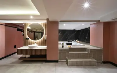 a bathroom with a sink and a mirror at Orka Royal Hotel & Spa in Istanbul