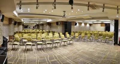 a large room with chairs and tables in it at Orka Royal Hotel & Spa in Istanbul