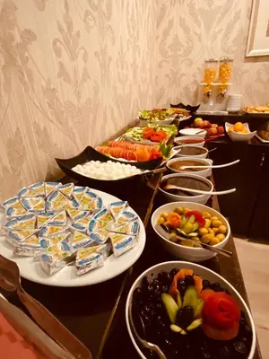 a buffet with many plates of food on a table at Adora Hotel in Istanbul