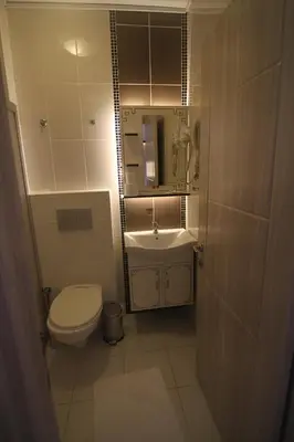 a small bathroom with a toilet and a sink at Grand Liza Hotel in Istanbul