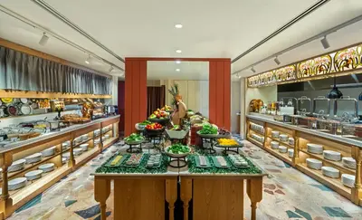 a buffet line in a restaurant with many food at Crowne Plaza Istanbul - Ortakoy Bosphorus by IHG in Istanbul