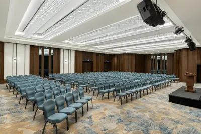 an empty lecture hall with chairs and a podium at Crowne Plaza Istanbul - Ortakoy Bosphorus by IHG in Istanbul