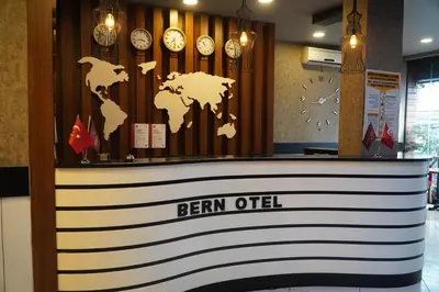 a lobby with clocks and a sign that reads ben otel at Bern Hotel in Istanbul