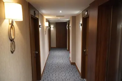 a hallway of a hotel room with a light on the wall at Bern Hotel in Istanbul