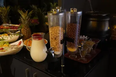 a counter topped with containers of food and drinks at Bern Hotel in Istanbul