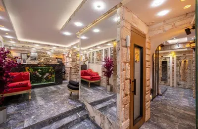 a lobby of a hotel with red furniture at REN PLUS SUITES in Istanbul