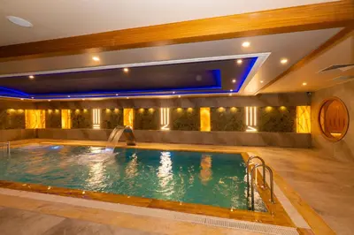 a pool in a hotel with a water slide at Ramada By Wyndham Istanbul Pera Taksim in Istanbul