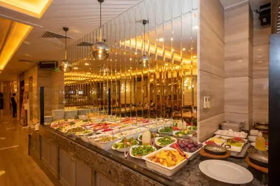 a buffet line with many plates of food at Ramada By Wyndham Istanbul Pera Taksim in Istanbul