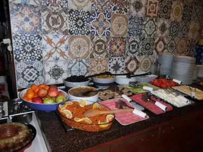 a kitchen counter with a bunch of food on it at Hotel Daphne in Istanbul