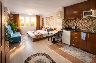 a hotel room with a bed and a kitchen with a table at Sultanahmet Center View Apart Hotel in Istanbul
