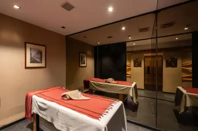 a room with two beds with red sheets at Pera Rose Hotel & Spa - Special Category in Istanbul