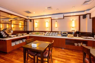a large kitchen with a table and a counter at Pera Rose Hotel & Spa - Special Category in Istanbul