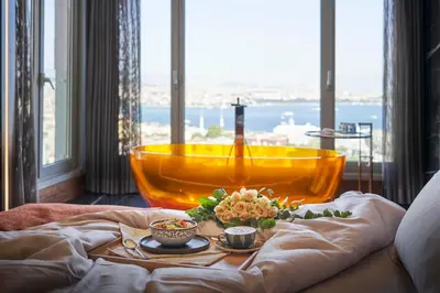 a bathroom with a large window with a bath tub at Richmond Istanbul in Istanbul