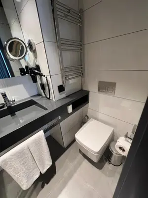 a bathroom with a white toilet and a sink at Trip Park Hotel in Istanbul