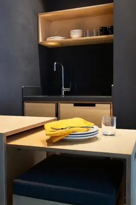 a table with a yellow napkin and a sink at Trip Park Hotel in Istanbul