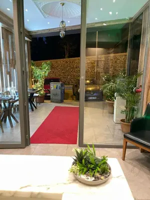 a room with a red carpet and a red rug at Aymira Suite Hotel in Istanbul