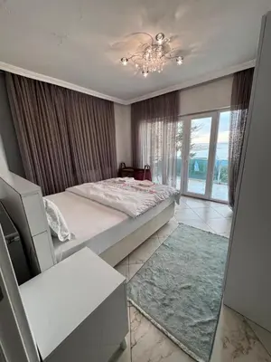 a bedroom with a bed and a large window at WHİTE ROSE VİLLA Jakuzili ve Isıtma Havuzlu in Sapanca