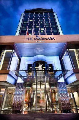 a building with a sign on the front of it at The Marmara Taksim in Istanbul