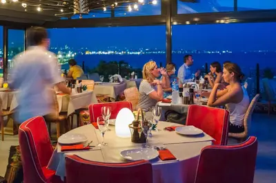a group of people sitting at a table in a restaurant at Tria Hotel Istanbul-Special Category in Istanbul