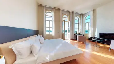 a bedroom with a bed with white sheets and pillows at A'jia Hotel in Istanbul