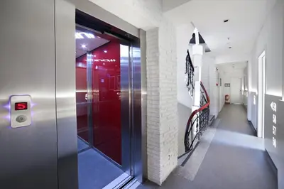 a hallway with a glass door in a building at The Central House Istanbul Taksim in Istanbul