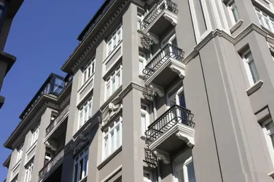 a tall white building with balconies on it at The Central House Istanbul Taksim in Istanbul