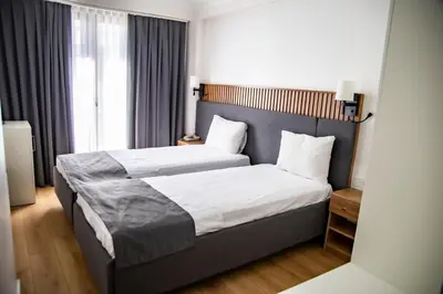 a bedroom with two beds and a large window at Silvana Hotel in Istanbul