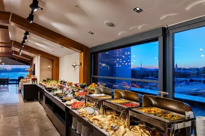 a buffet line at a hotel with food on it at Demiray Hotel Old City in Istanbul