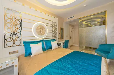 a bedroom with a large bed with blue pillows at The Million Stone Hotel - Special Category in Istanbul