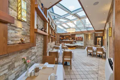 a restaurant with tables and chairs and a glass ceiling at The Million Stone Hotel - Special Category in Istanbul