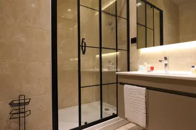 a bathroom with a shower and a sink at Hotel54 in Sakarya