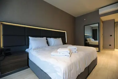 a bedroom with a large bed with towels on it at Hotel54 in Sakarya