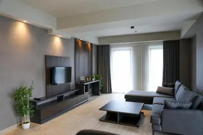 a living room with a couch and a tv at Hotel54 in Sakarya