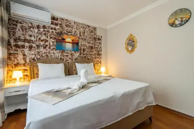 a bedroom with a bed with a towel on it at Blue Mosq- Three Storey Detached Villa in Istanbul