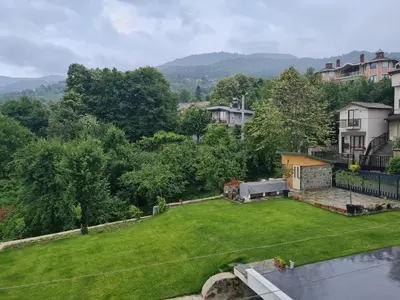 an aerial view of a yard with a large lawn at KD Apartments in Kartepe