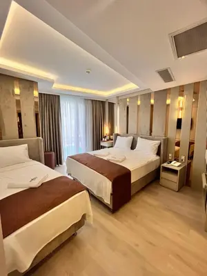 a hotel room with two beds in a room at Cetin Port Hotel in Istanbul