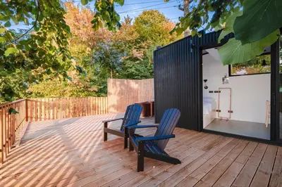 two chairs and a table on a wooden deck at Kartepe LOFT in Kartepe