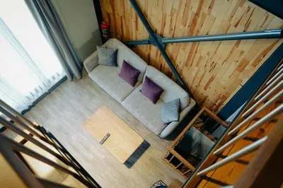 an overhead view of a couch with purple pillows at Kartepe LOFT in Kartepe