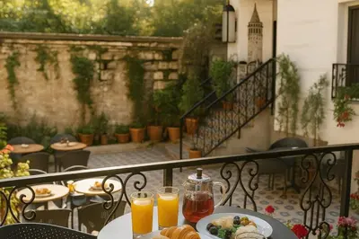 a table with a plate of food and two glasses of orange juice at Imagine Istanbul - Sultanahmet in Istanbul
