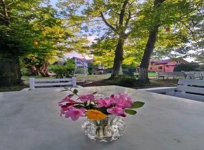 a vase of flowers sitting on a table at Villa Kirkpinar Sapanca in Sapanca