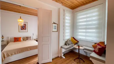a small bedroom with a bed and a window at Stanbul House in Istanbul