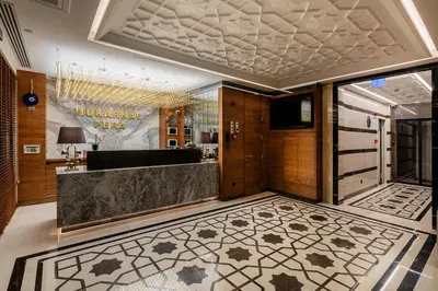 a lobby of a hotel with a reception desk at Mukarnas Pera Hotel in Istanbul